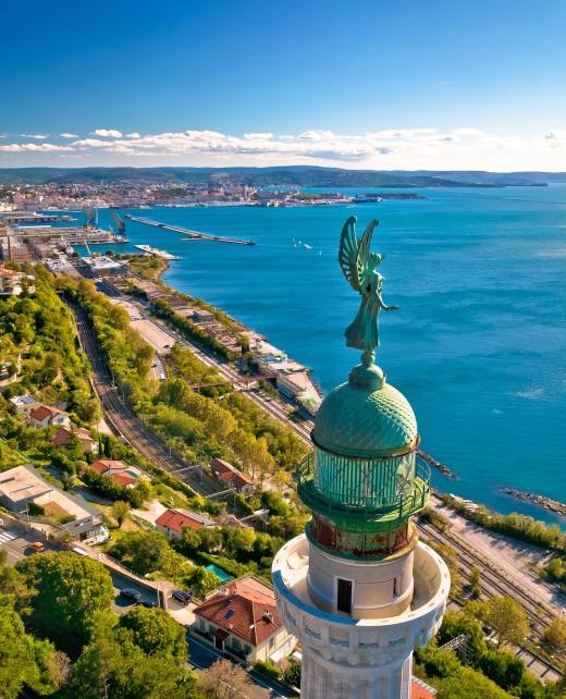 Trieste lighthouse Phare de la Victoire and cityscape panoramic aerial view, Friuli Venezia Giulia region of Italy